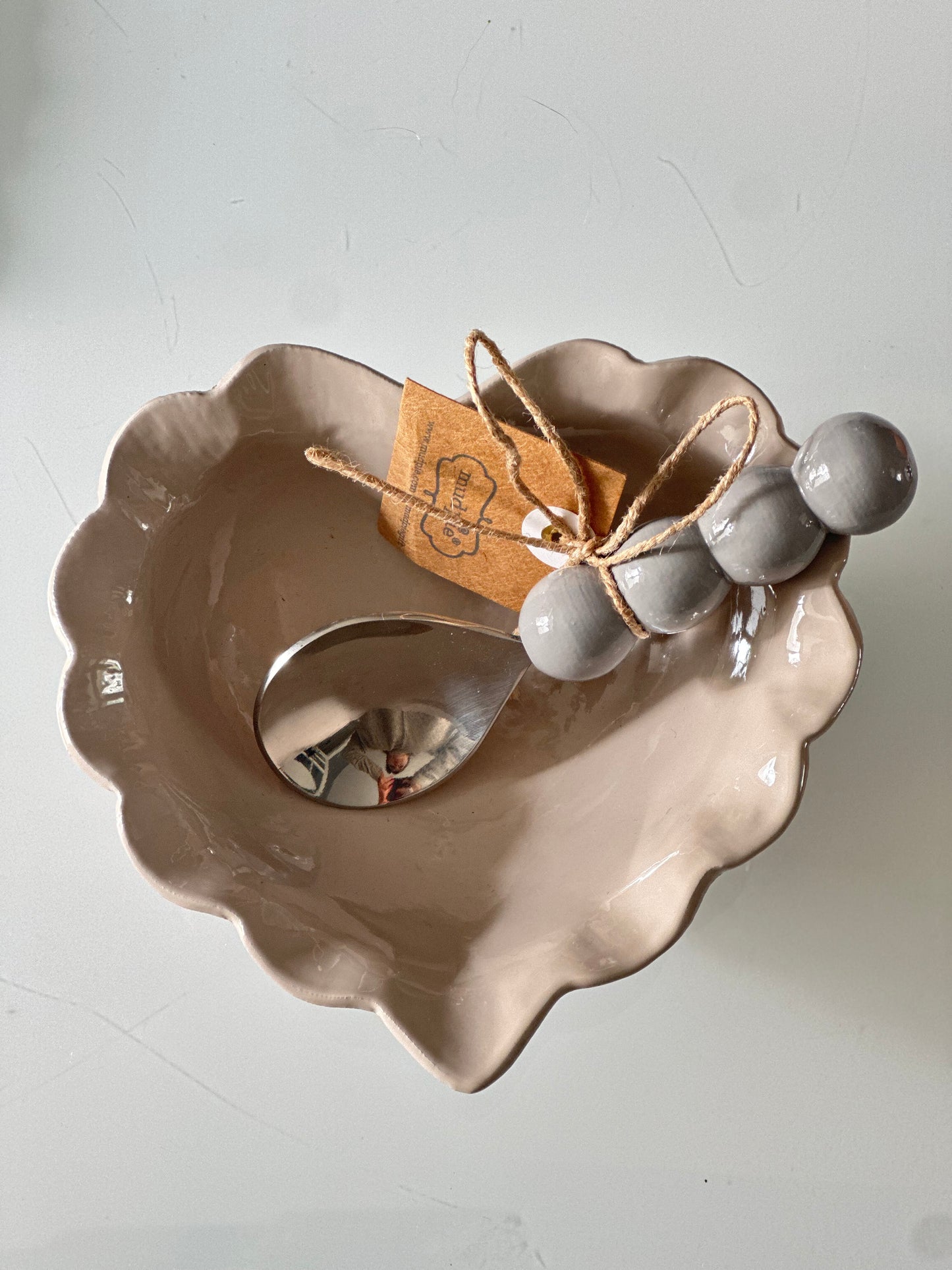 Taupe Heart enamel candy dish with gray spoon